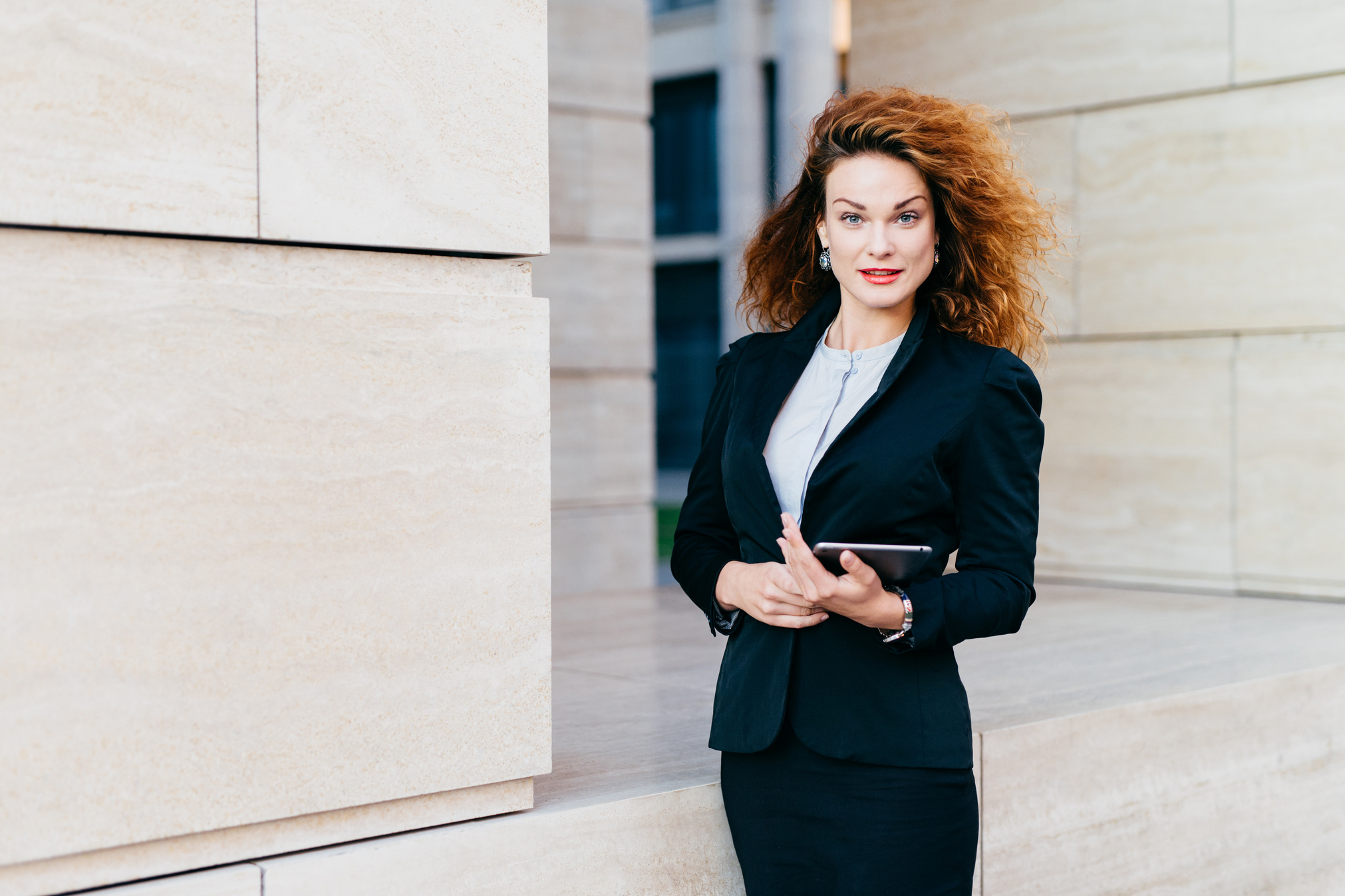 Serious Businesswoman Holding Smart Tablet 